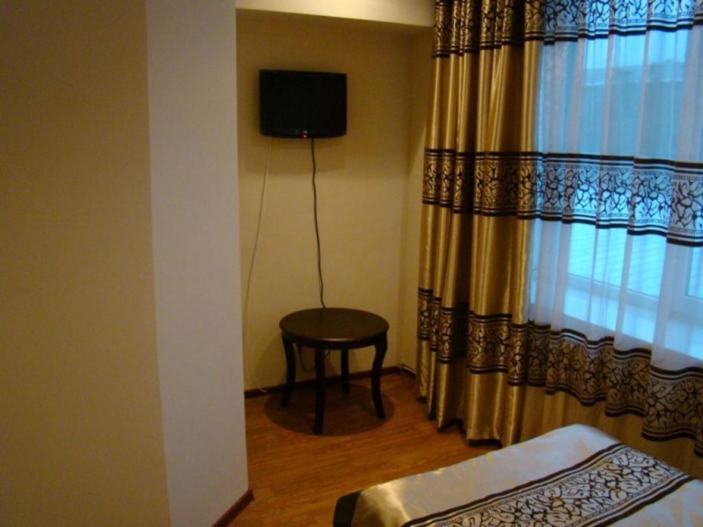 Kausar Hotel Almaty Quarto foto